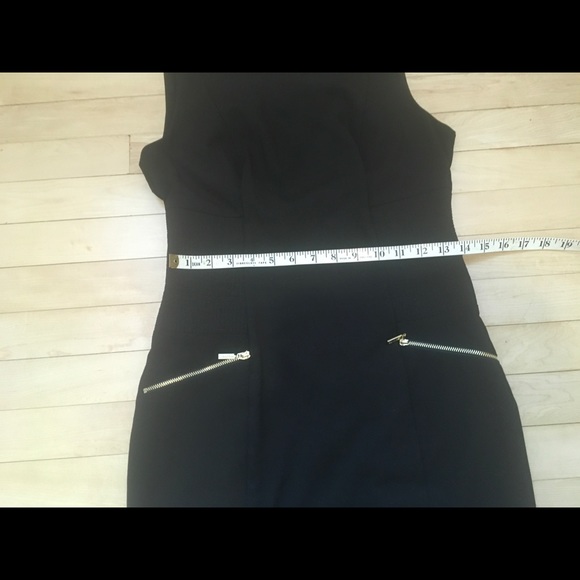 Lovely Calvin Klein black fitted dress, with gold accent pockets. - Picture 14 of 16